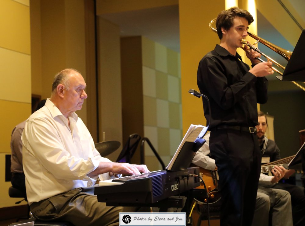 Two mans playing music instrument