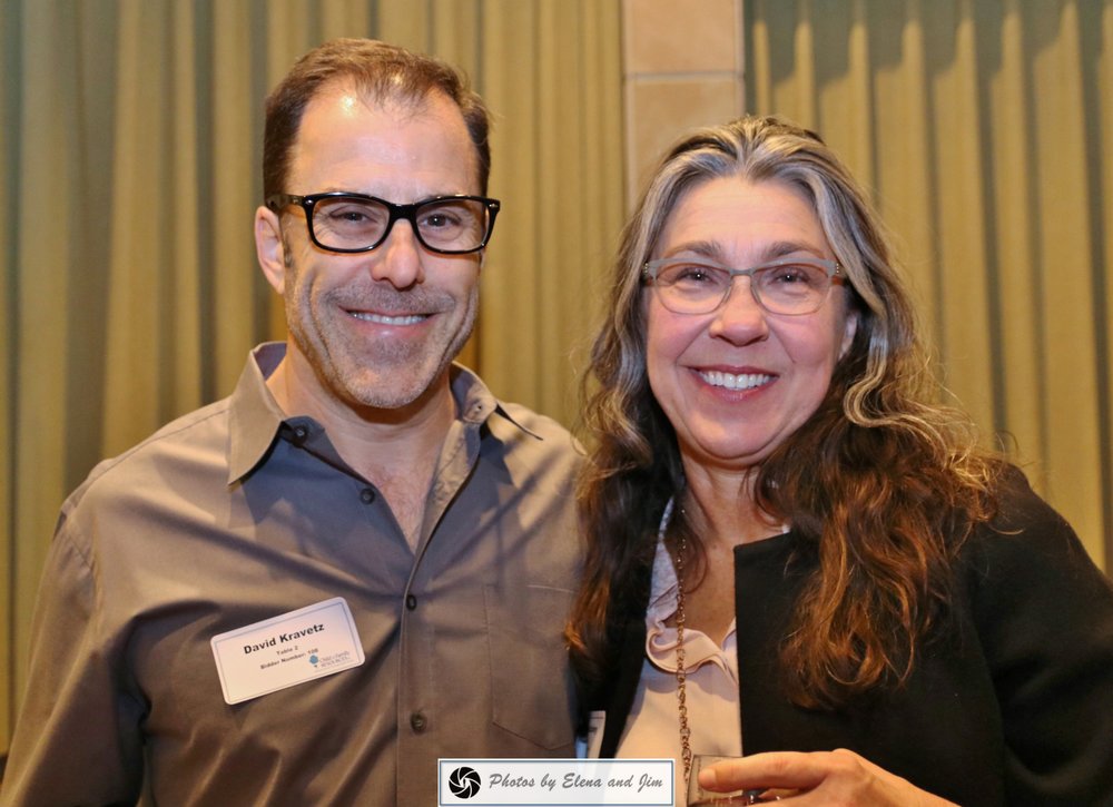 man and woman smiling together