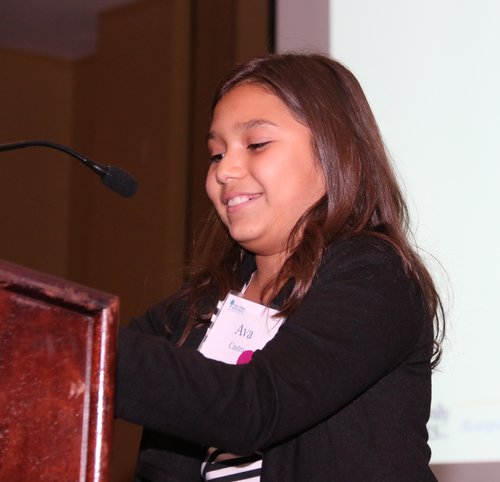 Little girl speaking on mic