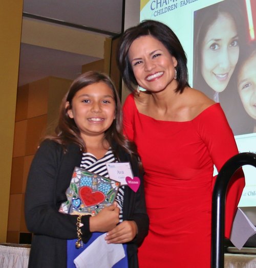 Happy women and little girl on stage