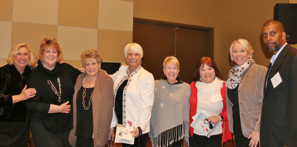 Seven women and one man group picture