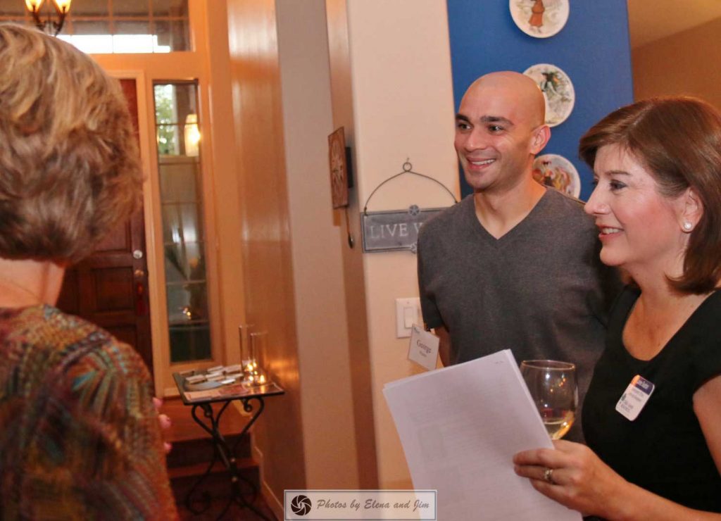 Man and women talking with receptionist