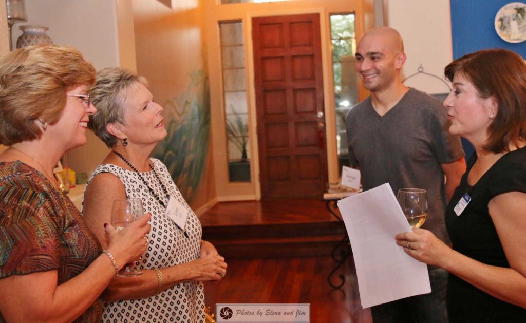 Man and women talking with two senior age women