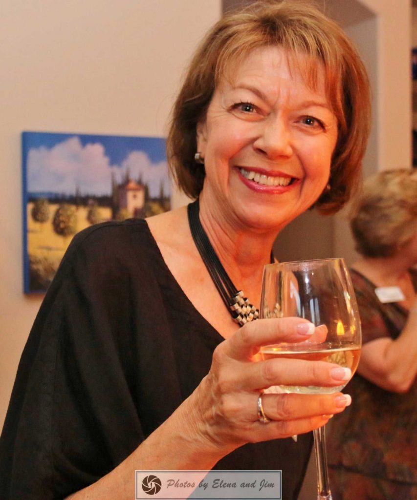 Happy women holding drink glass