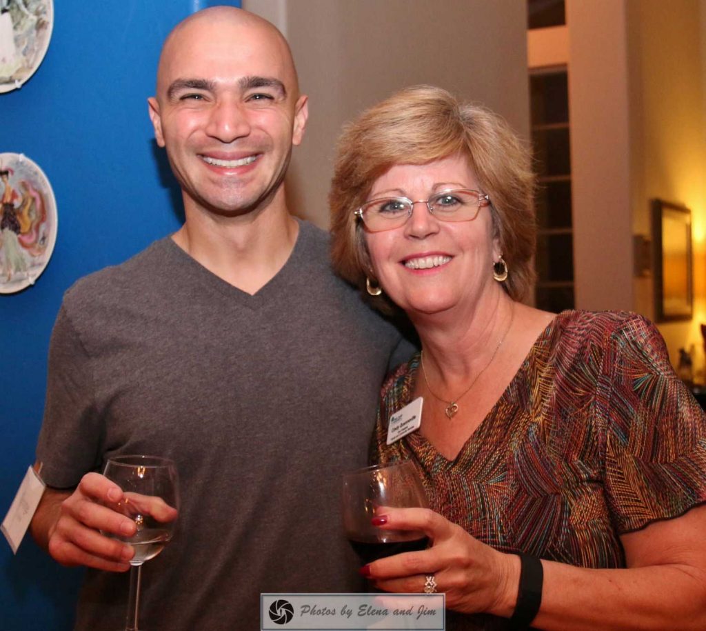 Happy man and women holding drink glass