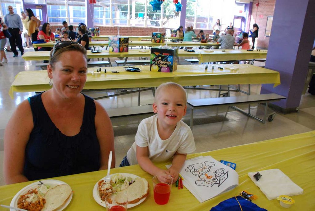 Women and little boy at dinning table