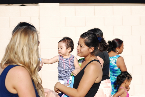 A lady holding a baby