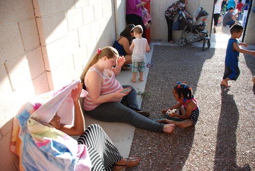 family sitting on the ground