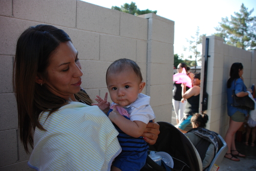 A lady holding a baby