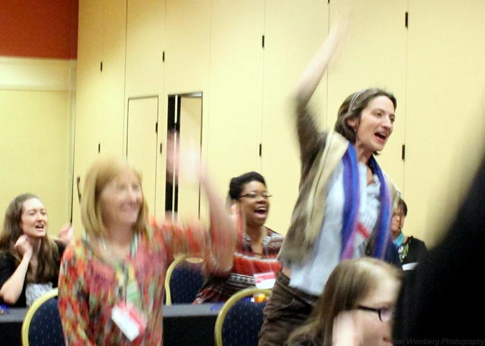 Members raising hands