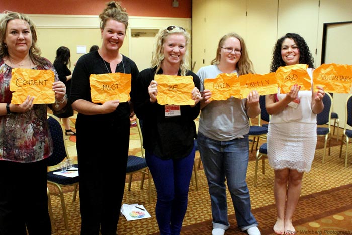 Girls holding banners