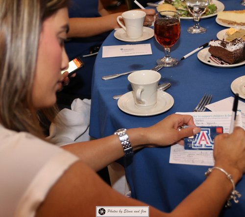 Women writing on a paper