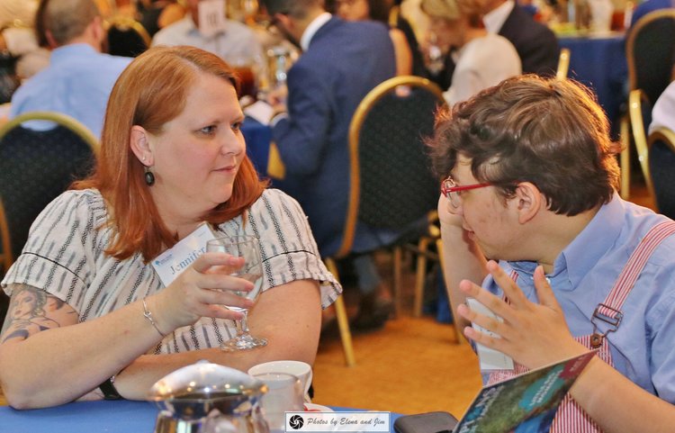 Man and women talking on dinning table