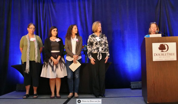 Five women on a stage