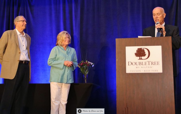 Three senior age people on stage