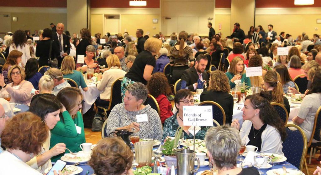 Groups of people eating on dinning table