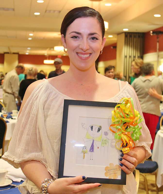 Happy women holding picture