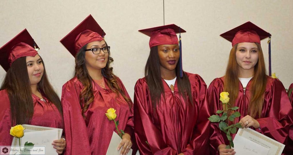 Four females with graduation cap