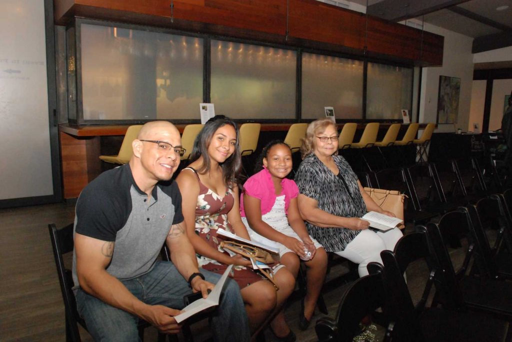 Family sitting on a chair