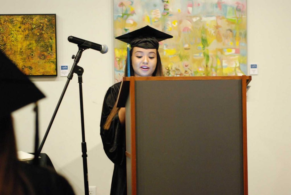 Women speaking on a mic