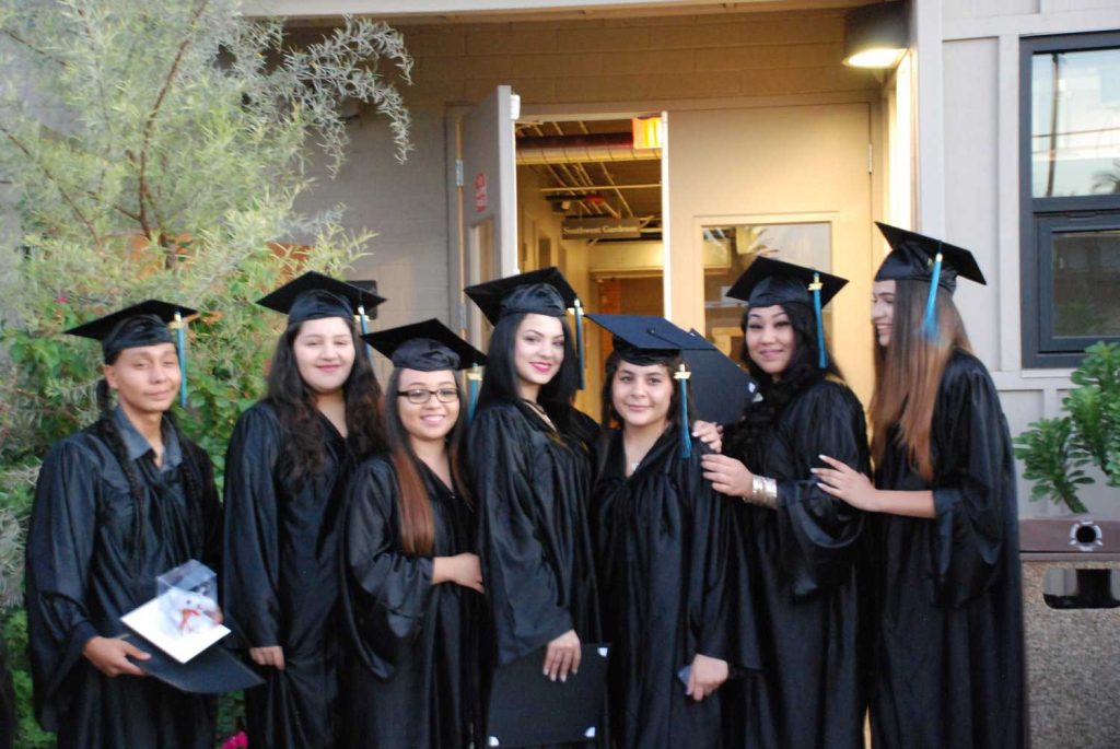 Seven female student with graduation cap