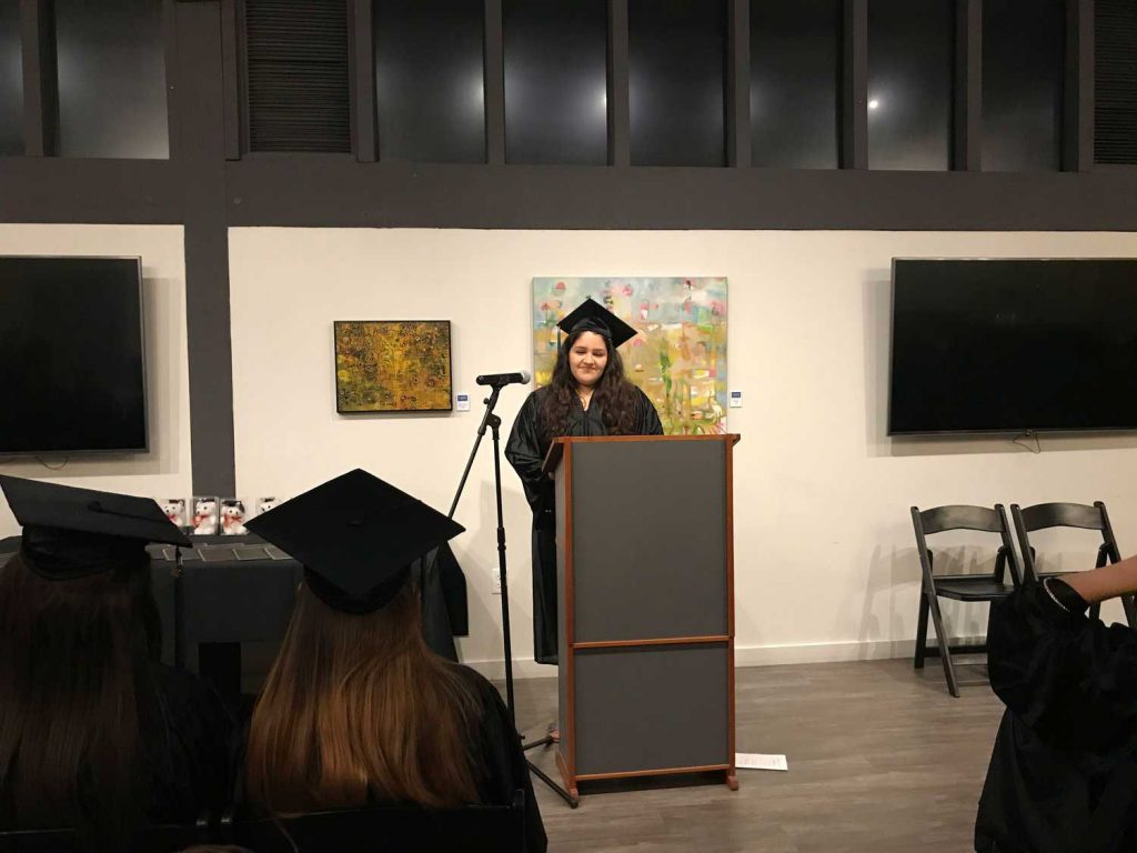 Women speaking on a mic