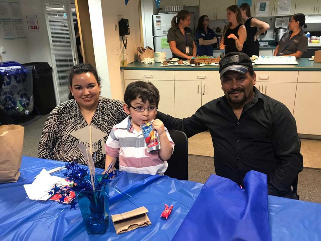 Parent with there little son on dinning table