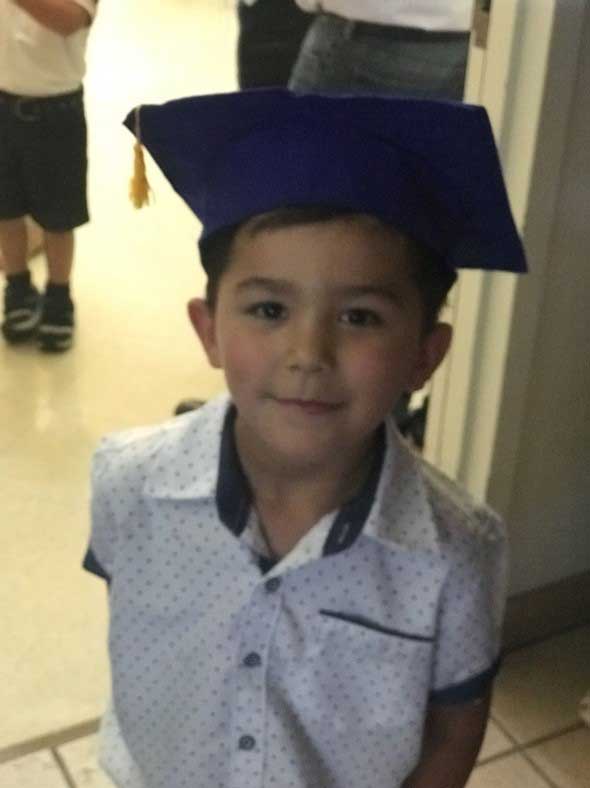 Little boy with graduation cap