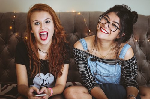 Two teen smiling picture