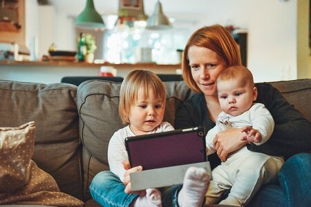 Mother and kids using mobile phone