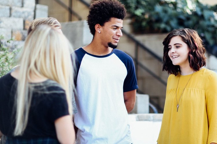 three friends are having conversation