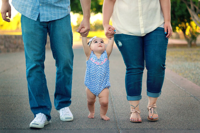 Couple walking with baby