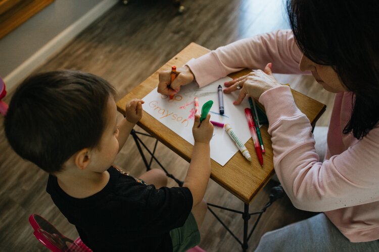 Mom and son drawing together