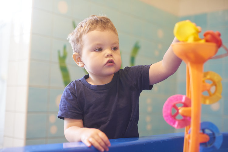 kid interacting with toys