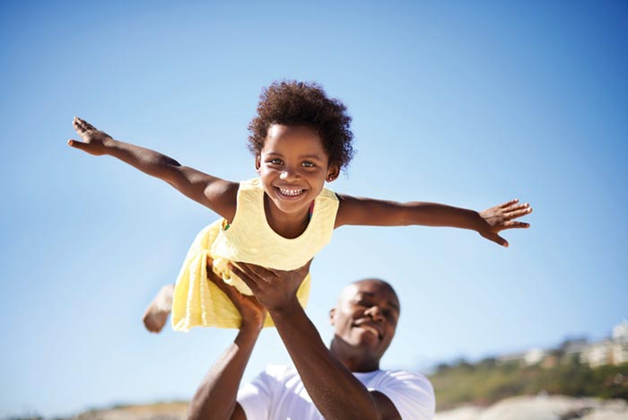 Father holding his daughter