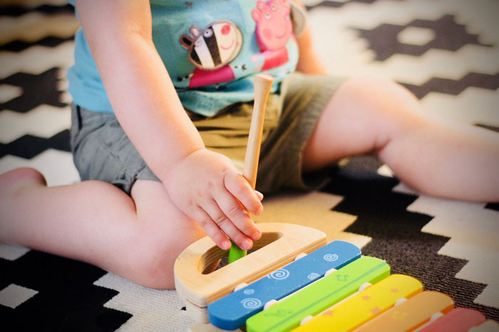 kid playing with toys