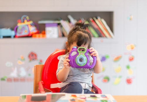 Little girl playing with toys