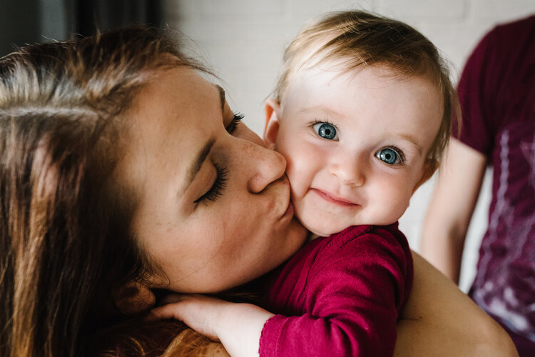 Mother kissing her son