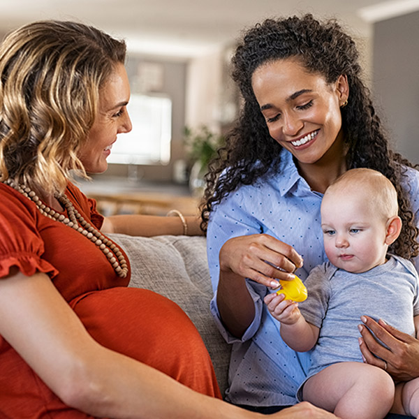 two moms with baby