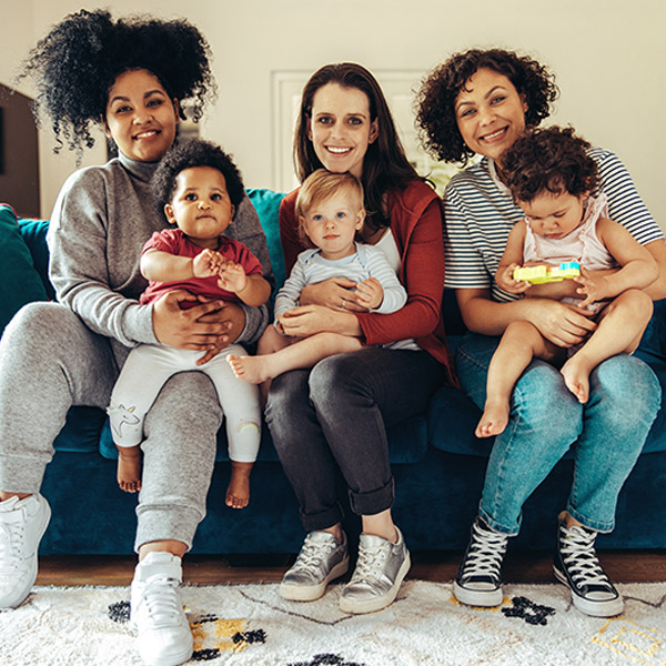 three moms with their babies