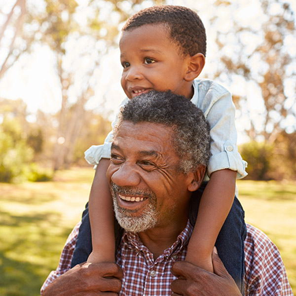 little boy on grandpas shoulders