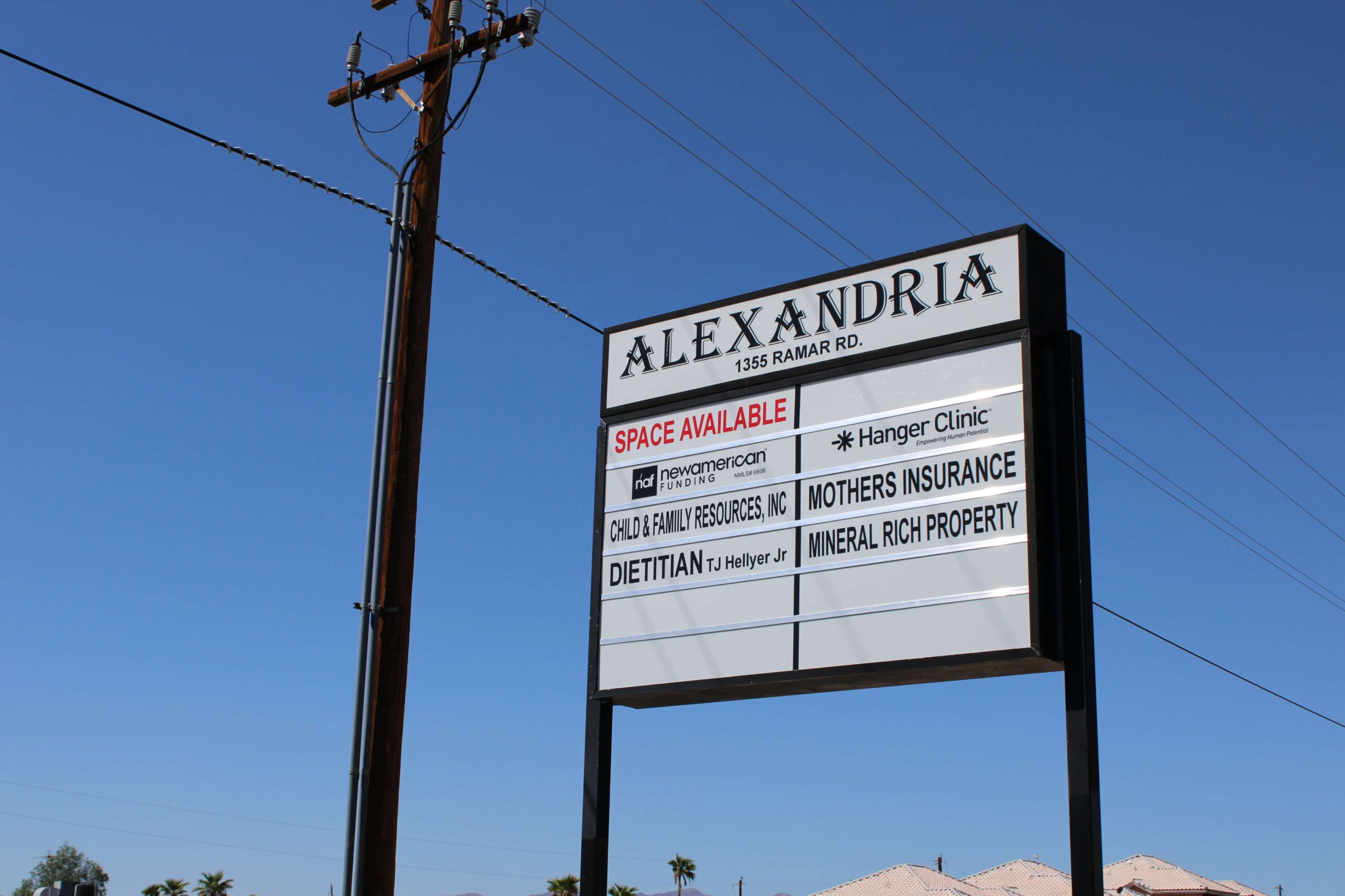 Roadside sign of Alexadra Plaza, Child & Family Resources location in Bullhead City, AZ