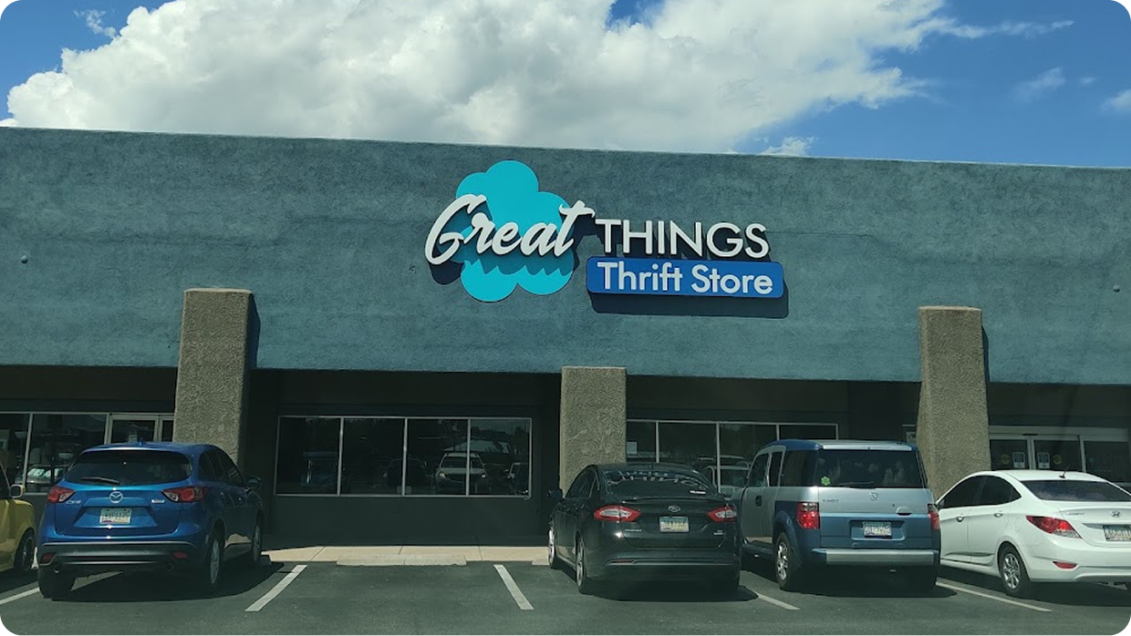 Storefront with blue "Great THINGS Thrift Store" sign