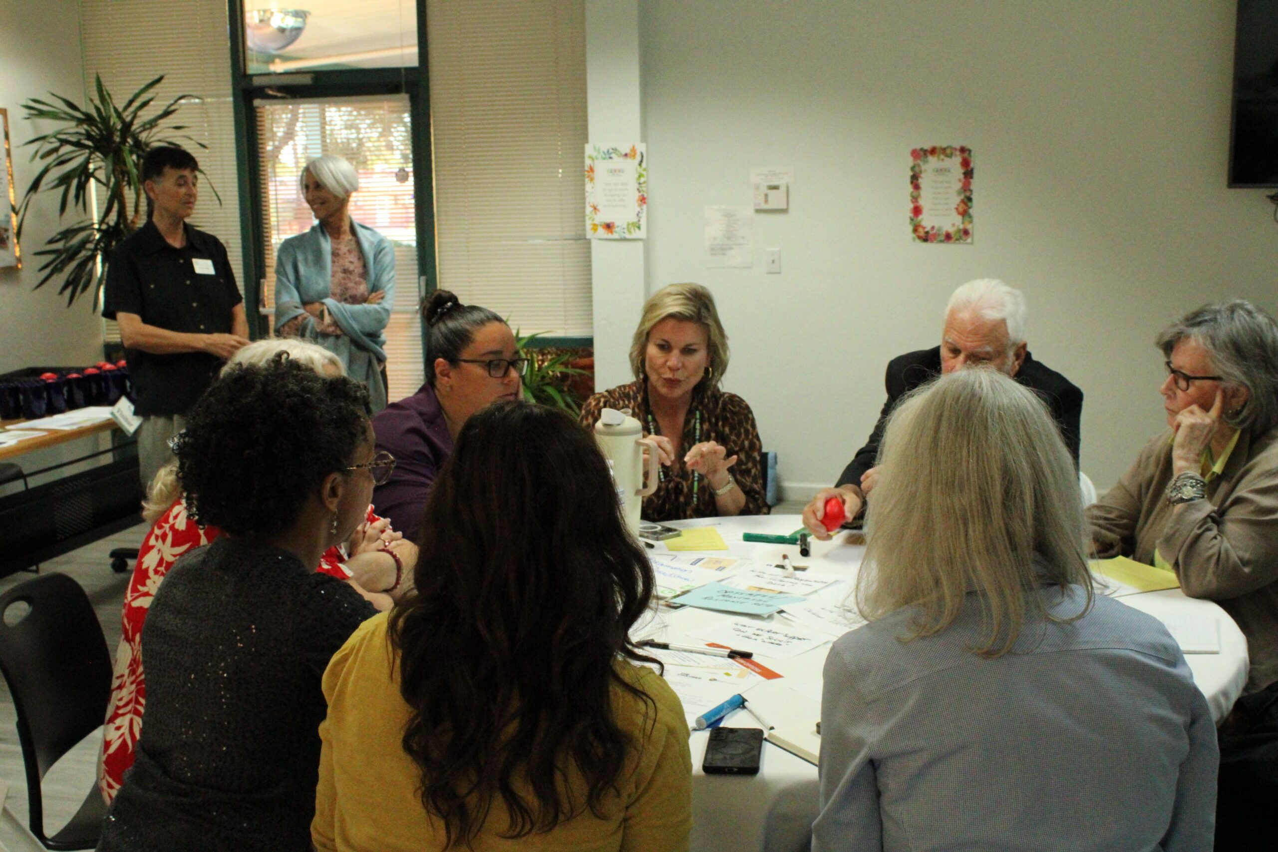 Community meeting at Child and Family Resources: adults around a round