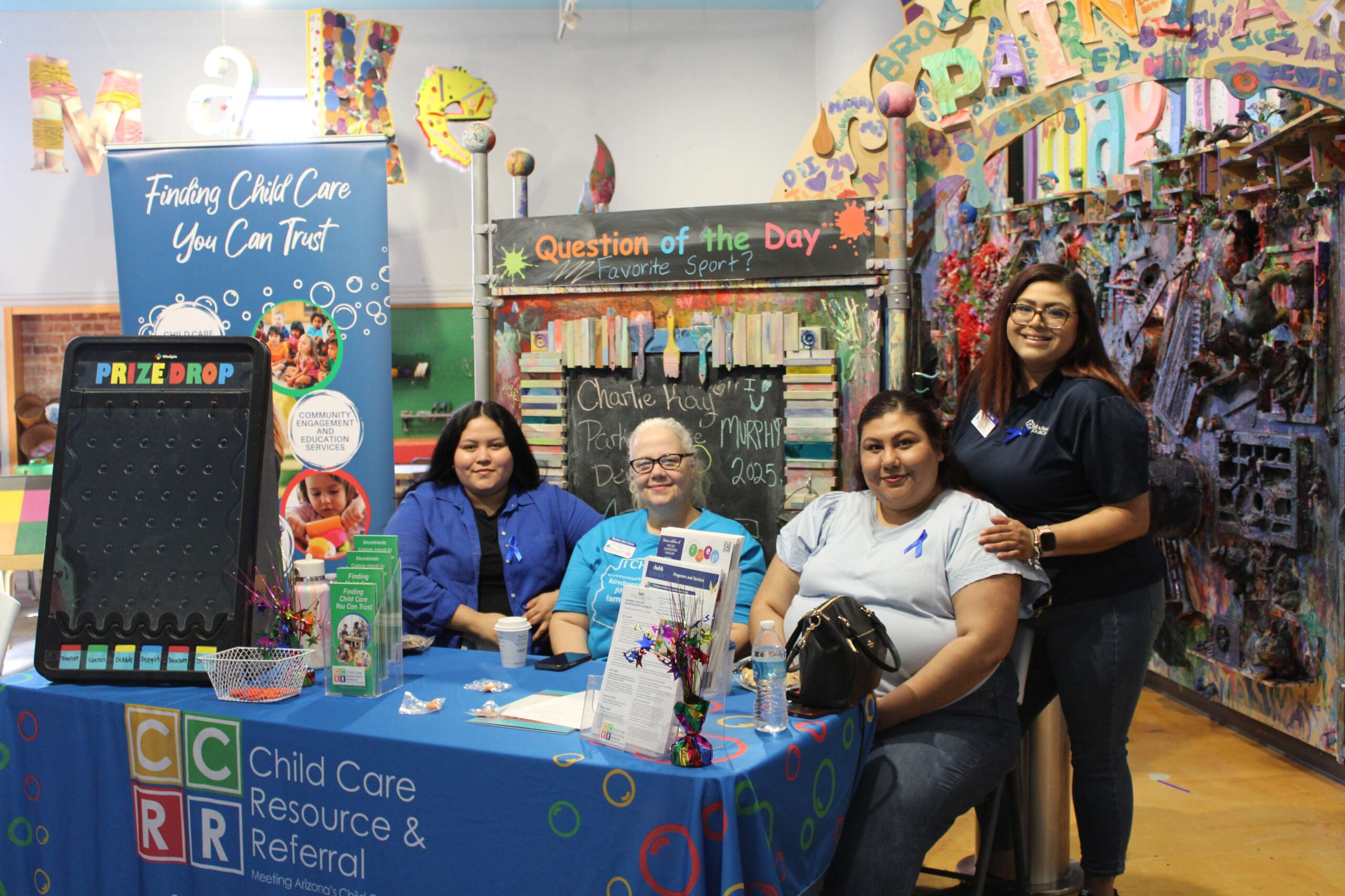 Four staff from Child Care Resource & Referral table at the 2025 Program Round Up